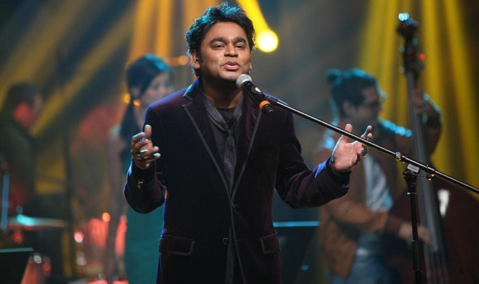 singer on stage singing into a microphone